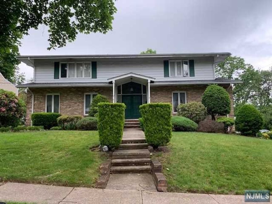 Well-maintained and bright center hall colonial in the prestigious town of River Edge. Approximately 3,000 sq ft of livable space featuring four bedrooms, two full bathrooms, and two half bathrooms situated on a peaceful dead end street. Ground floor of the home is permitted by the town to be used as a doctor's office or any other professional office space with six ample sized offices along with a half bath. Proximity offers incredibly easy access to the elementary school, NYC transportation, train station, shopping, restaurants and more. Perfect home for all families and professionals as well. Strictly sold "as-is".