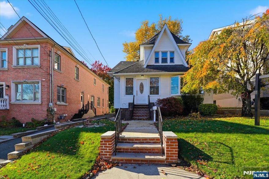 Charming, well-maintained second-floor apartment offering 3 bedrooms and 1 full bathroom, with hardwood floors throughout. The layout includes a bright sunroom connected to a spacious living area, offering a flexible floor plan. The living room and one of the bedrooms can be used interchangeably, allowing tenants to configure the space to suit their needs - whether that means a bedroom with a sunroom or a traditional living room setup. The unit features shared access to the rear yard, shared use of an on-site sauna, and includes one assigned driveway parking space. Spacious, functional, and filled with natural light, this home offers comfortable living with added versatility. Just a 3-minute walk to schools and transportation to NYC, making it a great option for those seeking space, character, and value.