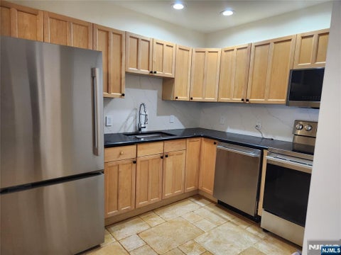 Photo of 399 11th ST #302, Palisades Park, NJ 07650 (MLS # 26030122)