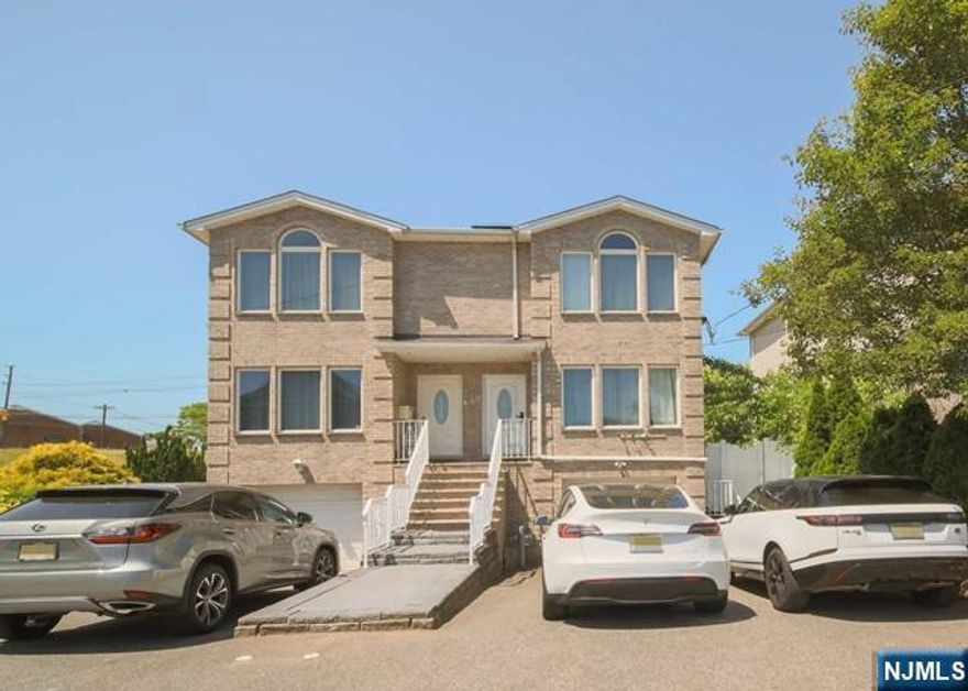 Young, bright, and well-maintained duplex in the prime location of Hackensack. This three bedroom, three full bath, and one half bath unit features bright natural lighting throughout the day along with great flow. Enter into the living room which flows effortlessly into the dining room then the eat-in kitchen with a breakfast nook and powder room. Second floor offers two generous sized bedrooms along with the master suite which is complimented by its ensuite master bathroom. Lastly, the full and finished ground floor features a recreational room, full bathroom, and access to the patio making this space perfect for any form of entertainment. Full security surveillance system along with fencing around the home has been installed for maximum convenience. Location offers close proximity to NYC transportation, shopping, dining and more.