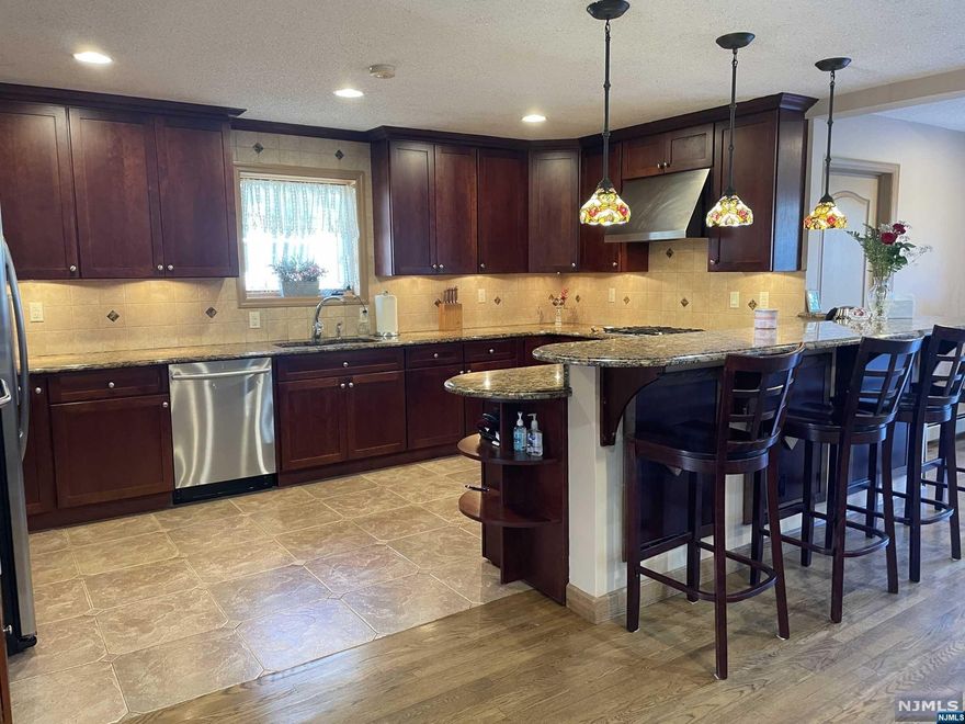 Welcome to this meticulously maintained rare to find in the desirable section of Clifton! This custom built home boast 15ft high ceilings upstairs, 5 bedrooms and 3 full bathrooms. The master bedroom and bath are like non other, master bath offers double jacuzzi, double shower, marble tiles, huge master bedroom with a walking closet, there is a large open floor plan downstairs with a formal dinning room, living room with the fire place, family room and open kitchen with the breakfast bar. Granite counter tops, stainless steel appliances. There is a finished basement with a huge recreation room, walk in closet-pantry and a boiler room. The house also has a CA and heating, central vacuum, an oversized garage, balcony above the garage, large shed, large crawl space for extra storage, and a brick patio in the back of the home. Close to the park, walking distance to the NYC bus, close to the train, shopping.