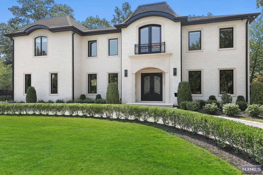 BETTER THAN NEW - BEST NORTH CLIFFS LOCATION - ELEVATOR TO ALL LEVELS - MAGNIFICENT BRICK AND PRECAST STONE (1 YR NEW) COLONIAL HOME with an open floor plan, transitional finishes, quality materials and meticulous attention to detail. This state-of-the-art SMART HOME boasts: a home theater, camera system, music, lighting, HVAC control and more. The Main Level features a Gourmet Kitchen completely open to a huge Family Room, Living Room, Dining Room, Powder Room and Guest Bedroom Suite. The extraordinary Primary Bedroom Suite includes: two luxurious Bathrooms, a Sitting Room with a fireplace and wet bar, and oversized customized closets. Three additional Bedroom Suites and a Laundry Room complete the Second Level. The Basement is fully finished and includes a fully equipped Home Theater, Recreation Rooms with a built-in bar, a Guest Powder Room, and an additional Bedroom and Bath. Radiant heat - Motorized shades - Backup generator - ABSOLUTELY STUNNING!