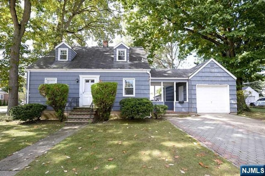 Welcome to this charming Dumont home, instantly captivating with its delightful blue exterior and undeniable curb appeal. As you pull into the driveway and step through the convenient breezeway, you're greeted by a designer kitchen, complete with a cozy nook where you can enjoy your morning coffee while watching the seasons change through the window. The kitchen flows effortlessly into the dining room, perfect for gatherings, followed by a spacious living room, a full bathroom, and a comfortable first-floor bedroom. Upstairs, two additional bedrooms await, along with a second full bathroom. The spacious, unfinished basement offers laundry and plenty of potential. Outside, the enchanting backyard invites you to imagine summer barbecues and leisurely afternoons. With its timeless charm and inviting spaces, this home offers a warm and whimsical retreat you'll love coming back to!