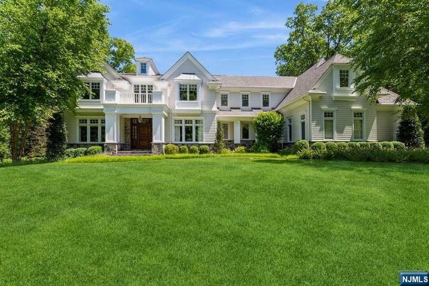 Welcome to the 2012 custom-built 8,500sqft masterpiece by renowned architect Robert Zampolin. Located on a tranquil cul-de-sac in Demarest, this home sits on .67-acre lot. Step inside a two-story foyer with spiral staircase featuring a floor to ceiling view to the backyard. The heart of the home is the expansive gourmet kitchen, featuring top-of-the-line Wolf and Sub-Zero appliances. The luxurious primary suite boasts his-and-hers bathrooms with steam shower, walk-in closets, and sitting room. 6 additional bedrooms, 4 ensuite. Laundry facilities on each floor and a half bath on the main floor add convenience. All floors feature 9 to 12-foot ceilings. The finished lower level offers state-of-the-art wine room, a living area with fireplace, a dedicated rec room, and an additional bedroom with a full bath. Extend your living outdoors with a Grecian-shaped saltwater pool and spa, bluestone patio perfect for al fresco dining, and built-in BBQ, all illuminated by LED accent lighting.