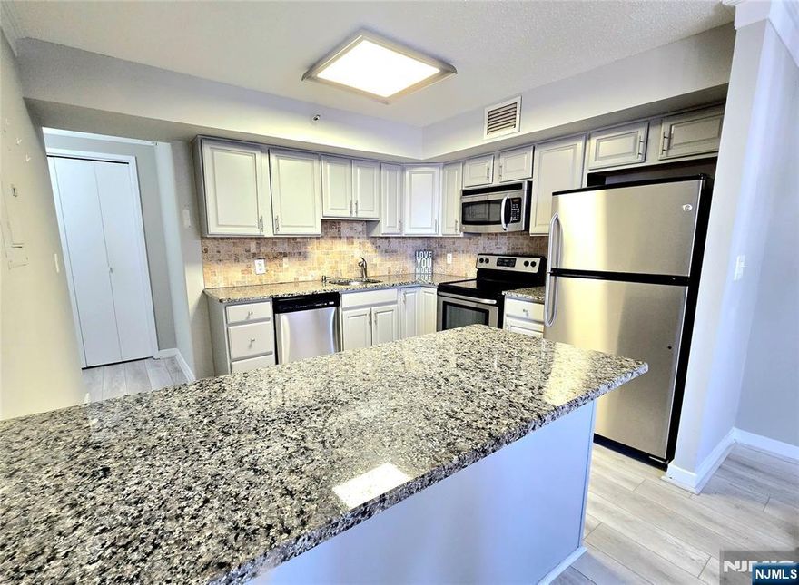 Beautifully Renovated Condo in the Prestigious World Plaza is ready to be Your New Home! Located on Desirable Prospect Ave. and right by NY Bus Stop, this will surely be convenient for any commuter! Boasting over 1000 square feet and completely move-in ready with nothing to do but unpack your bags! Updated features include Stainless Steel Appliances, Granite Countertops, Hardwood Flooring throughout, New Bathroom, and Freshly Painted with Crown Molding! Luxurious World Plaza has Large Outdoor Pool, 2 Gyms and 24hr Concierge. Laundry conveniently located right next to unit. Parking spaces available for $70 Outdoor/$80 Indoor.