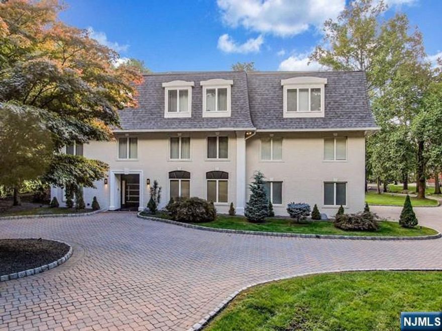 Majestic Expanded Brick Colonial on close to 3 acres with golf course views, and with expansive floor plan & breathtaking imported European doors throughout. Welcoming foyer into spacious den/music room. Luxurious guest suite featuring large living room, bedroom, modern full bath and kitchenette. Large living room/office with cathedral ceiling, wood recessed panels, fireplace and French doors to patio. Formal living room, open to banquet-sized dining room. Gourmet kitchen with large center island, Quartz countertops, high-end stainless appliances and access to private patio. Expansive theater, fitness room & powder room completes 1st level. Second level features large family room. Luxurious primary suite including fireplace, walk-in closet and primary bath with jetted tub and steam shower. Two large Junior suites with modern full baths. Two additional bedrooms with Jack-n-Jill full bath. Laundry room completes 2nd level. Beautiful, professionally landscaped property. New roof, windows and custom wood floors.