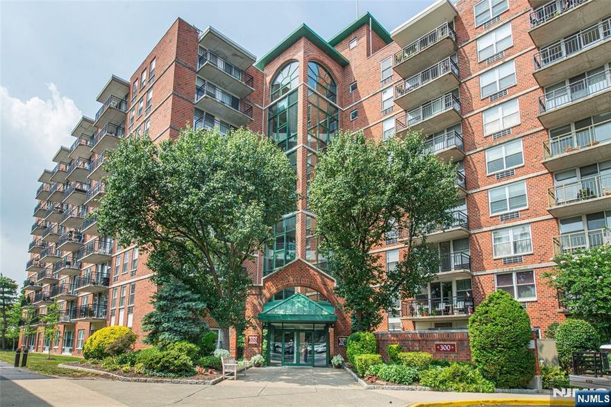 Here is your chance to be the Mayor of The Mill! Step inside this 1 bedroom perched on the 7th floor & you will feel on top of the world! Enjoy expansive Mountain views from your private balcony extending to the Parking Deck, Pool & Gym. Spacious open floor plan, gleaming hardwood floors & move-in ready! Sun-drenched living area open to galley style kitchen with white cabinets & SS appliances. Bedroom w/ Walk-in closet & built in organizers + updated full bath with neutral tones. Enjoy the ease of low maintenance, one-floor living with laundry in building & assigned covered garage parking. You will be living the "STAYCATION" lifestyle every day while enjoying full service luxury amenities including pool, pedestrian plaza, 2 tennis courts, jogging/walking path, state of the art fitness center & newly remodeled community room with fireplace & pool table. NYC Commute - NO PROBLEM! Steps to NYC & Hoboken Trans by Bus or Train. Bring your FRIENDS (plenty of visitor parking) & your FUR BABIES - The Mill is Pet Friendly!