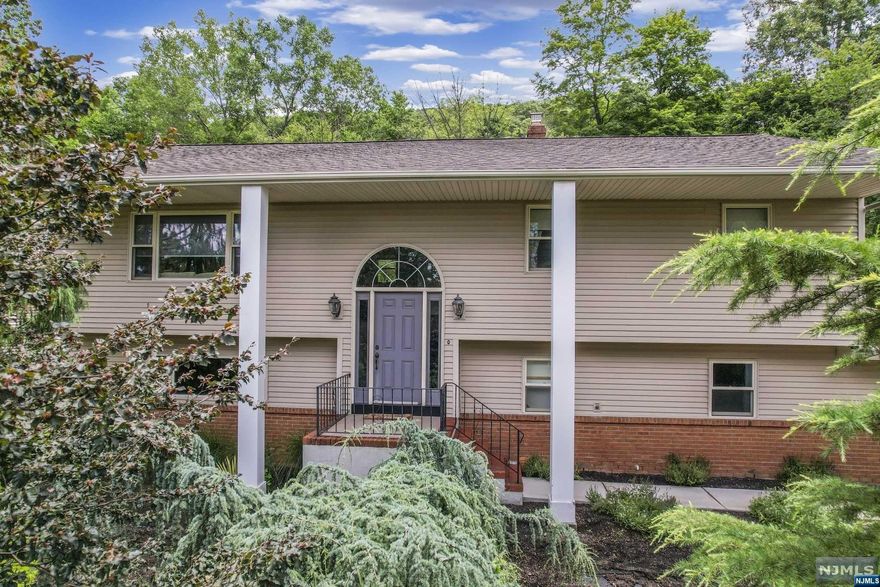 Beautifully maintained Bi-Level featuring 5 bedrooms and 3 bathrooms. Comfortably greet your guests in the entry foyer, which leads up to the open concept main living area. The kitchen offers custom cabinetry with plenty of storage, SS appliances, granite countertops and center island with bar stool seating. The dining area is the perfect spot for any Holiday dinner or just a quiet night at home. Sliding glass doors lead out to the rear deck. Down the hall is the primary suite featuring spacious bedroom, large closet and en suite with dual storage vanity and shower with sliding glass enclosure. 2 additional bedrooms & full bath with storage vanity and tub shower complete the main floor. The ground floor offers family room/den, which is a great place to relax and unwind. Sliding glass doors lead out to the backyard. The are also 2 bedrooms, full bath with shower and laundry room. The deck leads down to the spacious backyard. 2-Car attached garage and ample driveway parking.