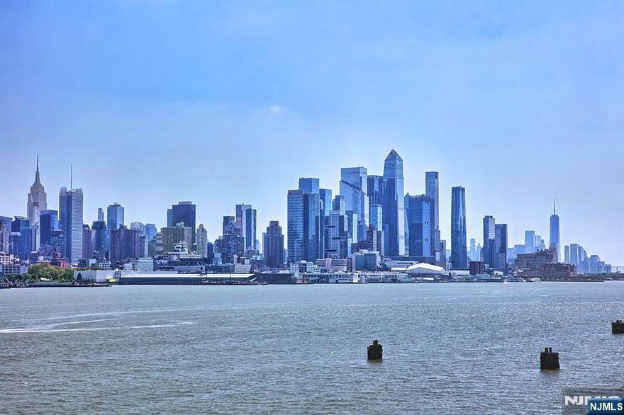 Exceptional Jacobs Ferry Essex style townhome for sale!! Best located Essex in entire community!! NYC views from every room in the house. Southernmost row-second unit from the water with stunning NYC views and overlooking Eagle Park. Oak hardwood floors. Kitchen boasts granite counters and island, maple cabinetry and subway tile backsplash. Deck off of kitchen offers World Class views day and night. First floor bedroom features full bathroom and built-ins. Private patio of first floor. Third level has two bedrooms with bathrooms en suite. The marvelous loft area on top has dormer enclosed added bedroom and half bath. Sweeping NYC views from loft balcony. Newer HVAC system with two zones. New water heater. Parking for two cars, one in private garage with custom shelving and one in driveway. Sought after community has two outdoor pools with jacuzzis, playground for the children, waterfront promenade and free shuttle to the Ferry and Light Rail. Steps to 158 bus to Port Authority. Close to restaurants and shopping. The Epitome of Waterfront Living!!