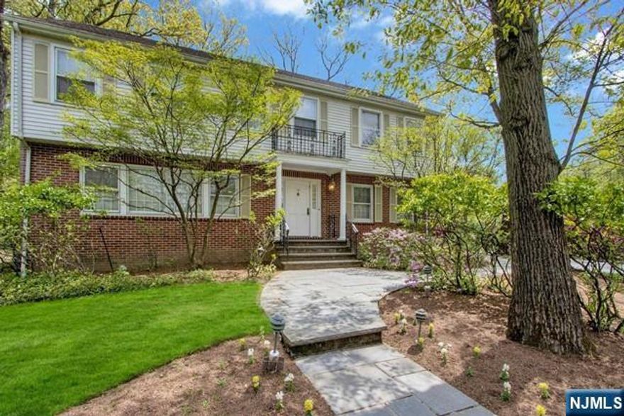 WELCOME TO THE DESIRABLE EAST HILL SECTION OF ENGLEWOOD AND THIS SPACIOUS CLASSIC COLONIAL. FIRST FLOOR IS ELEGANTLY APPOINTED WITH STUNNING ARCHITECTURAL MOULDINGS. ENTRY HALL, LIVING RM & DINING RM WITH FRENCH DOORS, LIBRARY,MARBLE FPL,BUILT IN BOOKCASES, POWDER RM. ENJOY ENTERTAINING IN THE GREAT ROOM WITH PALLADIAN STYLE WINDOWS ABOVE THE DOORS LEADING TO THE PATIO.A LARGE KITCHEN, SPCAIOUS CENTER ISLAND,GRANITE COUNTERTOPS,DINING AREA WITH DOORS TO PATIO, OFFICE NOOK, SKYLIGHTS & BEAUTIFUL HERRINGBONE OAK FLOORS COMPLETE THIS SPACE. 5 BEDROOMS & 3 BATHROOMS ON THE SECOND FLOOR.THIS INCLUDES: THE PRIMARY SUITE ,DRESSING ROOM, WALK IN CLOSET, MARBLE BATH RM WITH JACUZZI STYLE TUB & SEPARATE SHOWER. ADDITIIONAL 4 BEDROOMS,2 BATHROOMS & A LAUNDRY ROOM. FULL FINISHED BASEMENT, BATH RM & STORAGE. ATTACHED 2 CAR GAR, GENERATOR, NEW HVAC SYSTEM & HOT WATER HEATER INSTALLED THIS YEAR. NEAR HOUSES OF WORSHIP,DOWNTOWN ENGLEWOOD, HIGHWAYS & GW BRIDGE. A HOME NOT TO BE MISSED!