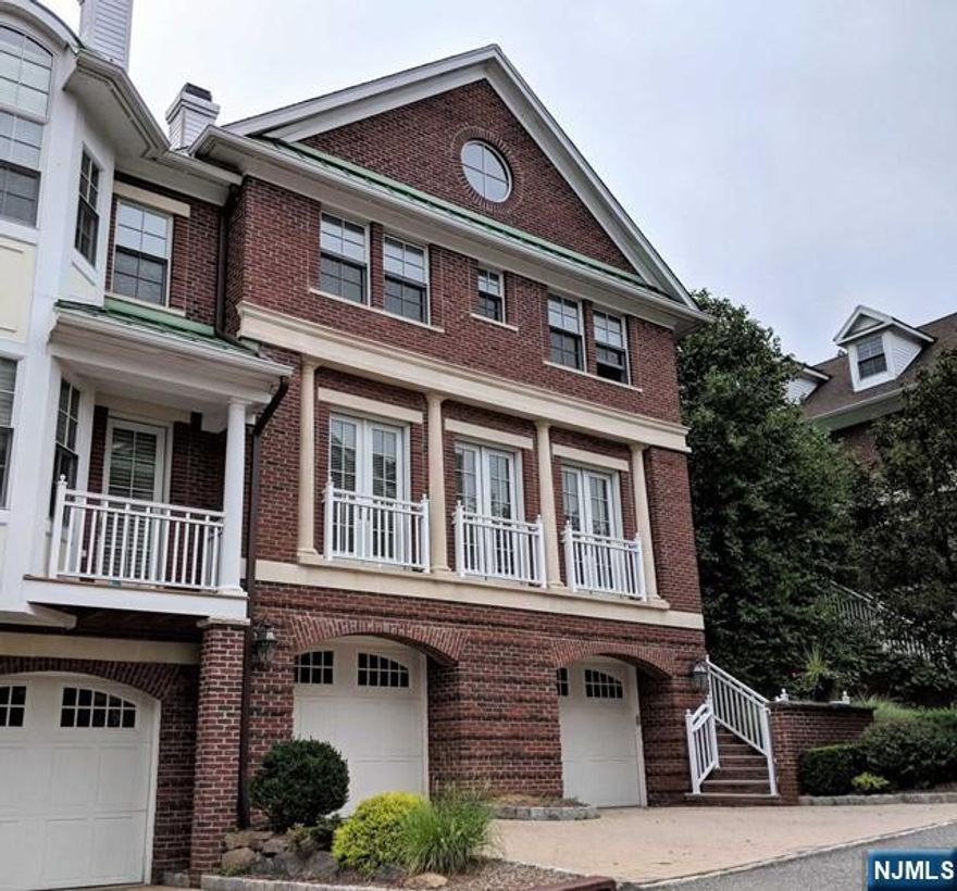 Beautiful townhouse located in sought after Heights of Tenafly. Bright south facing corner unit with deck in the rear. First floor features living room with fireplace and built in bookshelves leading into formal dining room. Gourmet kitchen with Sub Zero refrigerator, Viking 6 burner stove, granite countertops and dining area leading to rear deck. Second floor includes primary suite with fireplace, dual walk-in closets and primary bathroom. Completing the upstairs are 2 additional bedrooms with personal full bathrooms. On the ground level is an oversized 2 car garage, laundry room (w/d and sink), family room leading out to rear patio, full bath and fourth bedroom. Private elevator reaching each floor. *Photos taken prior to current tenant.