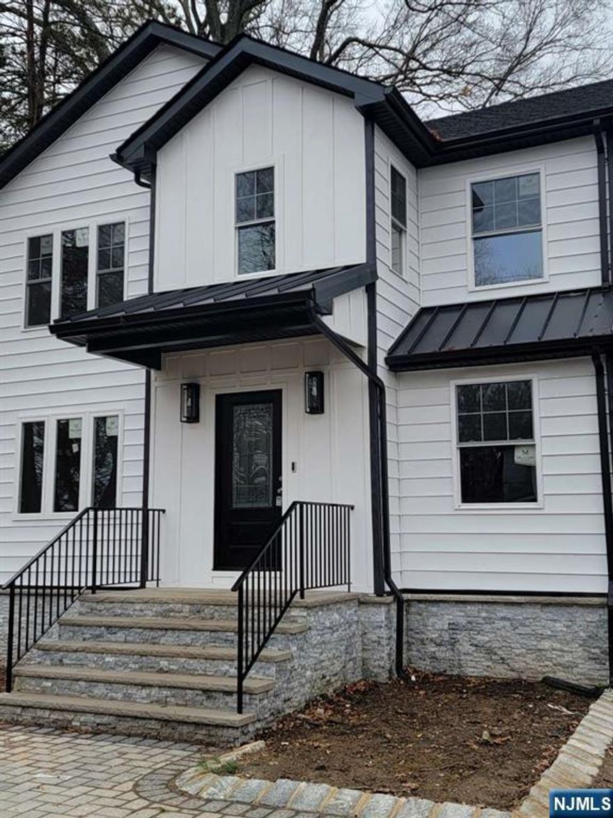Showings start 3/14. Welcome to this stunning, fully renovated 4 bdrm, 3 full bath home offering approx 2500 sq ft of living space, including a fully finished walk-out basement. Professionally designed by InVision Interior Designs, LLC for modern living, this residence blends luxury, flexibility, and exceptional commuter convenience. The 1st flr features a thoughtfully modernized kitchen that blends style and functionality, a private bedroom en-suite with a full bath and a custom carved-out additional area ready to be tailored to your lifestyle-ideal for a home office, playroom, fam room, or additional lounge space. Upstairs, you'll find three generously sized bedrooms with spacious closets, including a spectacular primary suite with its own versatile extra room, perfect for a nursery, office, dressing room or oversize walk-in closet. The walk-out basement further expands your living space with laundry hook ups, a recreation area, and direct access to the expansive, park-like backyard for seamless indoor/outdoor living. Set on an oversize 75x170 lot, the property offers a detached garage, Ring security system, and an extra long driveway accommodating up to six cars. Additional features include a two-zone heating and cooling system with Ecobee smart thermostats. Ideally located within walking distance to a direct NYC bus and close to schools, houses of worship and the community center this turnkey home delivers the space, layout, and location today's buyers are searching for.