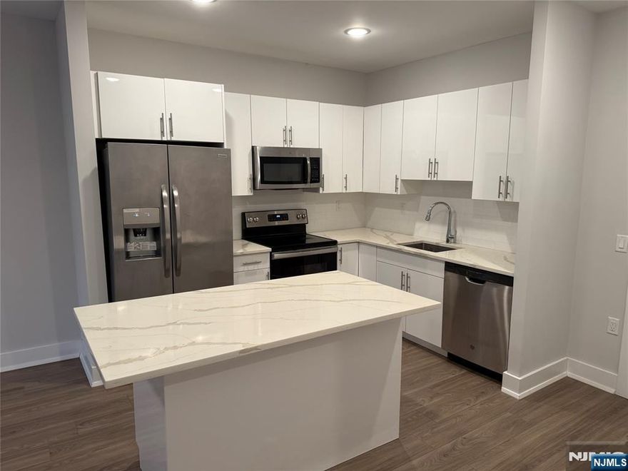 **ONE MONTH FREE on 13-month lease + one parking space included! - for occupancy commencing on or before 6/1/25!** Welcome to The Addison - Fort Lee's new luxury rental building offering a variety of upscale, spacious floor-plans. The Addison offers high-end residences fully equipped w/ modern kitchens w/ stainless steel appliances, quartz countertops, full islands & tiled backsplashes, open living/dining areas, shades on all windows, modern bathrooms & a full-sized washer & dryer in each unit. Exclusive 24/7 virtual doorman service for communications, package deliveries & access control via video intercom system linked to your smart phone. The Addison includes a large on-site fitness center including virtual touchscreen workout mirror, electric car charging stations & parking garage w/ direct elevator access to all residences for uncompromising security. Pet friendly - (25 lb limit) $500 pet fee + pet rent per month. Tenants pay ALL utilities. All amenities INCLUDED in the rent! PARKING: Additional spaces - $100/monthly. Virtual tour available upon request!