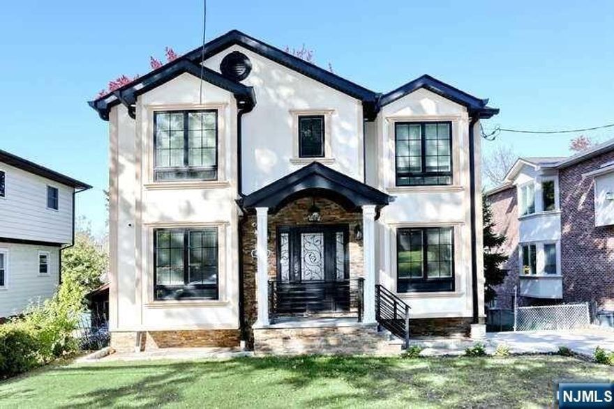 ***NEW Constructed Home in Desirable Neighborhood*** Why settle for an apartment at the same price, only to face unpredictable maintenance costs? Experience modern living in this stunning single-family home built on a solid foundation. Enjoy LOW property taxes and a hidden wired security and sound system. **Top Floor:** Spacious master suite with walk-in closet, luxury bathroom with double sinks and shower; plus a second bedroom with full bath. **First Floor:** Open living and dining area, full bath, and a kitchen with high-quality appliances. **Outdoor Space:** Large deck overlooking a fenced-in backyard. **Ground Floor:** Fully finished two-room suite with summer kitchen and washer/dryer. Don't miss this incredible opportunity! **Schedule your tour Today !**