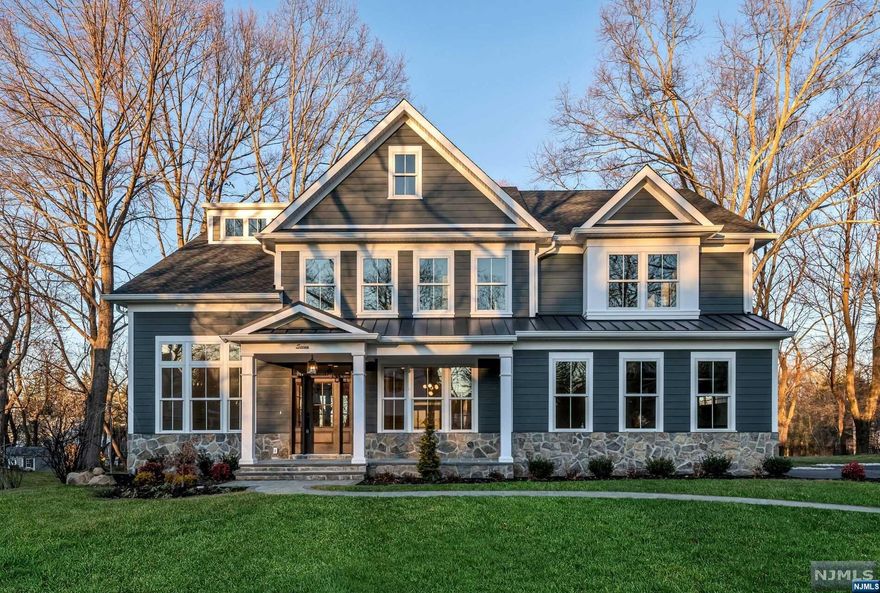 Discover luxury within this new construction, side hall colonial home, nestled on a sought-after street in Florham Park. Boasting over 6,000 square feet of finished space and offering an attached side 2-car garage. The first floor introduces a spacious bedroom with a lavish en-suite, a culinary haven with a stunning 10-foot quartz island, and top-of-the-line appliances in the kitchen. Entertain effortlessly with a large deck extending from the dinette and a family room featuring a fireplace that opens onto a deck. The main level is further enriched by a powder room, a versatile flex room, and a formal dining room off the front foyer. Ascend to the second floor, revealing four well-appointed bedrooms, three full baths, including a primary suite with an enormous walk-in closet. A secondary suite and two additional bedrooms. The third floor unveils a sixth bedroom. Descend to the basement, a sprawling 1800 square feet of finished space with a bonus full bath and wet bar.