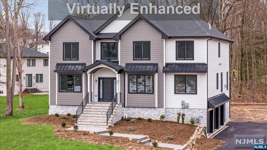 Stunning, bright, NEWLY CONSTRUCTED Colonial with a sleek blend of classic & contemporary finishes on tree-lined property. A gracious interior highlighted by spacious, open floor plan, high ceilings, elegant details, hardwood floors, crown molding & recessed lighting throughout. The 2-story foyer is flanked by a living & dining room w/ adjacent butler's pantry + wine fridge. Just beyond is an incredible, sun filled open kitchen & great room. The gorgeous chef's kitchen has ample white cabinetry, quartz counters, center island & high-end appliances, while the great room features a gas fireplace & wooded backyard vistas. A private office/den and 1/2 bath complete this level. Upstairs a large Primary Suite with huge WIC, luxurious bath boasting a dual vanity, soaking tub & oversized shower, as well as 4 more big bedrooms, 2 full hall baths & convenient laundry. A finished walkout basement, plus a 4th full bath & access to garage. Everything's new, nothing to do but unpack and enjoy!