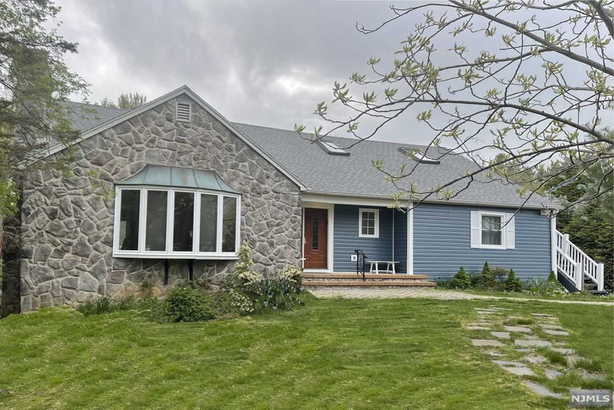 You will fall in love with this stunning 5bed+4bath Expanded Ranch with big park style Front and Backyard located on .61AC property. Beautiful spacious Living Room with a bay window and the formal Dining Room with a patio door overlooking a gorgeous composite deck. Eat in Kitchen with custom cabinets, granite tops and counters, a big center island with storage and a microwave drawer. Gleaming Solid Bamboo hard floors. Two separate Central Air/Heat systems. Whole house generator. Large In-law Suite on 2nd floor with washer/dryer and a separate entrance. Partially finished big Walkout basement. 2 car attached garage. Top-rated Schools, beautiful Downtown. Close to NJ Transit trains.