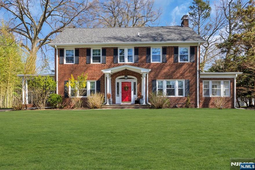 Set on a generous property within the sought-after Montrose Park Historic District, this distinguished center hall Colonial offers a seamless blend of classic design and modern refinement. A welcoming foyer introduces a series of elegant living spaces, including a front-to-back living room with a wood-burning fireplace, custom built-ins, and French doors opening to a sunlit den and private terrace. Designed with both everyday living and entertaining in mind, the formal dining room connects to a screened porch, while the updated kitchen, featuring quartz countertops and stainless steel appliances, flows into a bright breakfast room with a bay window overlooking the backyard. A mudroom and powder room complete the main level. The second and third floors include five well-appointed bedrooms, three full bathrooms, and a versatile office space. The finished lower level features a recreation area with wet bar, laundry, powder room, and a sauna with steam shower, offering a private, spa-like retreat. A detached three-car garage allows for additional storage. Conveniently located near South Orange Village, parks, and NYC trains. Be sure to review the full list of updates.