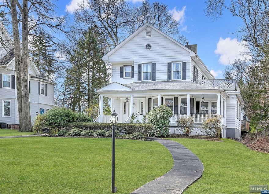 his beautiful expansive colonial gem, sits on treelined street in lovely Englewood. House boasts lemonade porch, barn-style two car garage, large deck and spacious yard. Upon walking inside, the home will capture your heart with its warm yet roomy presence. Glorious foyer with grand staircase. Hardwood floors throughout. Central air conditioning, The luxurious living room with marble fireplace has plenty of space for entertaining, with attached dining room. Large Kitchen has stainless steel appliances and lots of cabinet space. First level powder room is perfect for guests. Grand staircase leads upstairs to 4 bedrooms. Master suite has deck and sitting room with large bathroom and jetted tub. Agent Remarks: A must see! This beautiful expansive colonial will meet all your client's needs.