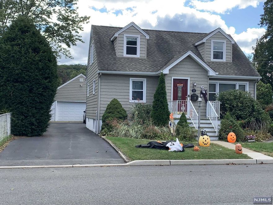 Zoned 2 Family. Currently used as extended Family. 2nd Floor Kitchen As/Is. Newer Central Air, Furnace, Baths and Main Kitchen. Beautifully renovated. Huge 2 Car Detached Garage. Finished Basement 3 Baths, Custom Window Treatments and Light Fixtures. A Private Yard. Proximity to Highway, Sho[[ing Restaurants and Schools. A Rare Find. Large Deck off the main Living Area with Retractable Awning. Lovely yard with room to Garden, Relax and Entertain