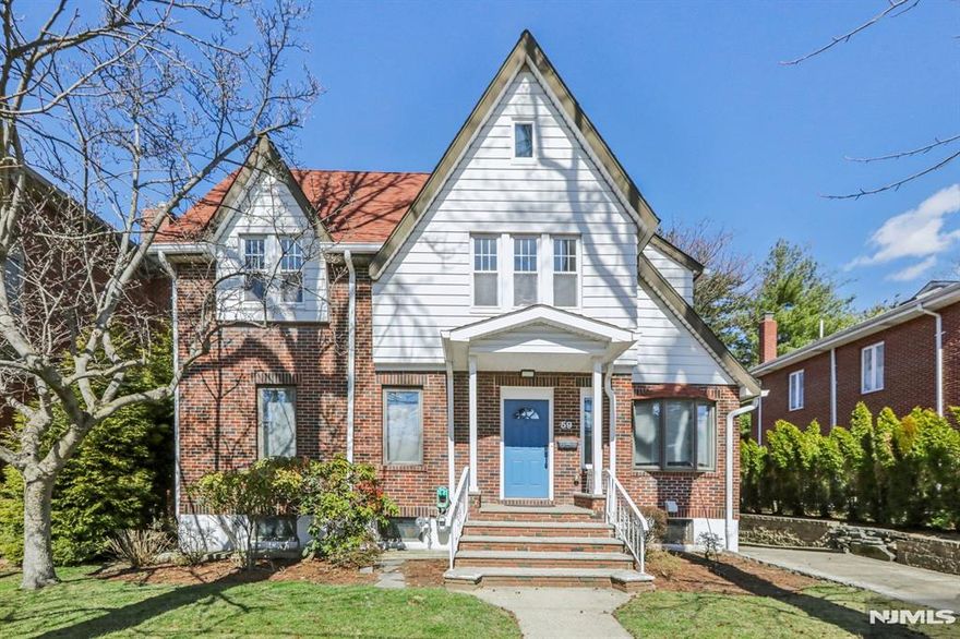 Elegant Colonial home in a prime Fort Lee location offering beautifully designed space across multiple finished levels, including a versatile attic/bedroom and an impressive lower level. The main floor features a gracious foyer, expansive living room, formal dining room, spacious kitchen with direct access to an oversized rear deck, office/bedroom, and a full bath. The second floor offers three generously sized bedrooms, including a spacious primary suite with ample closet space, along with two full baths. The finished attic/bedroom adds valuable flexible space for guests, a home office, lounge, or creative use. With three bedrooms on the second floor plus the office/bedroom and attic/bedroom, the home offers the flexibility of up to 5 bedrooms. The finished lower level features a large recreation area, wet bar, additional kitchen area, laundry room, utility space, and full bath. Outdoor highlights include an expansive deck ideal for entertaining, a private backyard, detached garage, and driveway parking. A rare offering that blends timeless character, exceptional versatility, and everyday comfort in one of Fort Leeâ€™s most desirable locations.