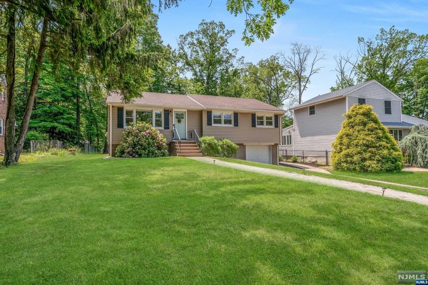 Updated and move-in-ready ranch-style home located in the desirable Ramapo Mountain Lakes community on a 1/2 acre. Open and airy floorplan with hardwood floors throughout, sparkling white kitchen with newer stainless steel appliances, updated full bath, 3 bedrooms and downstairs is phenomenal for extended entertaining, a big laundry room with shiplap surround, storage and a great functional mudroom that exits to the extended one car garage. The large deck overlooks the fenced back yard with lush lawn and a fun area for fireside gatherings. Property goes beyond back fence. Brand new septic system currently being installed. Picture perfect!