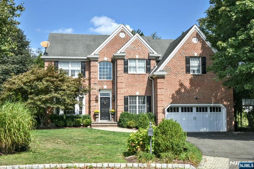 Discover the perfect blend of elegance and comfort in this exquisite 5-bedroom, 4.5-bath colonial home. Step into the inviting living room ideal for relaxing evenings. The formal dining room sets the stage for memorable gatherings, while the eat-in kitchen offers a convenient space for casual meals. Unwind in the spacious family room, complete with a fireplace, or retreat to the dedicated office for work or study. The primary bedroom is a true sanctuary, boasting an en-suite bath for ultimate privacy and convenience. The finished basement provides an exceptional entertainment space, complete with a screening area for movie nights or game day fun. This home is a perfect haven for both everyday living and entertaining, ready to welcome you!
