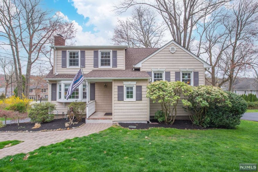 One of the best locations in desirable Packanack Lake Community- Lake Views! Amazing home for entertaining & newer impressive kitchen. Wonderful open floor plan, charming living room with fireplace and lots of natural light, all open to newer kitchen with modern flair: center island, custom cabinets, stainless steel, subway tile backsplash, stylish light fixtures with dining room and coffee or bar area. Upper levels features: large bedrooms & baths. Incredible primary suite option with large bedroom, private bath and additional bedroom for office, dressing room or den. Family room with sliding glass doors to deck. Newer hardwood floors, recessed lighting, custom window treatments, newer windows, newer roof, oversized garage and shed for storage. If you love the outdoors this is the home for you: multiple decks, fire pit area & steps to lake. Great Location. Top rated schools. Minutes to shopping, restaurants, Whole Foods, NJ Transit Bus & Train Center & major highways.