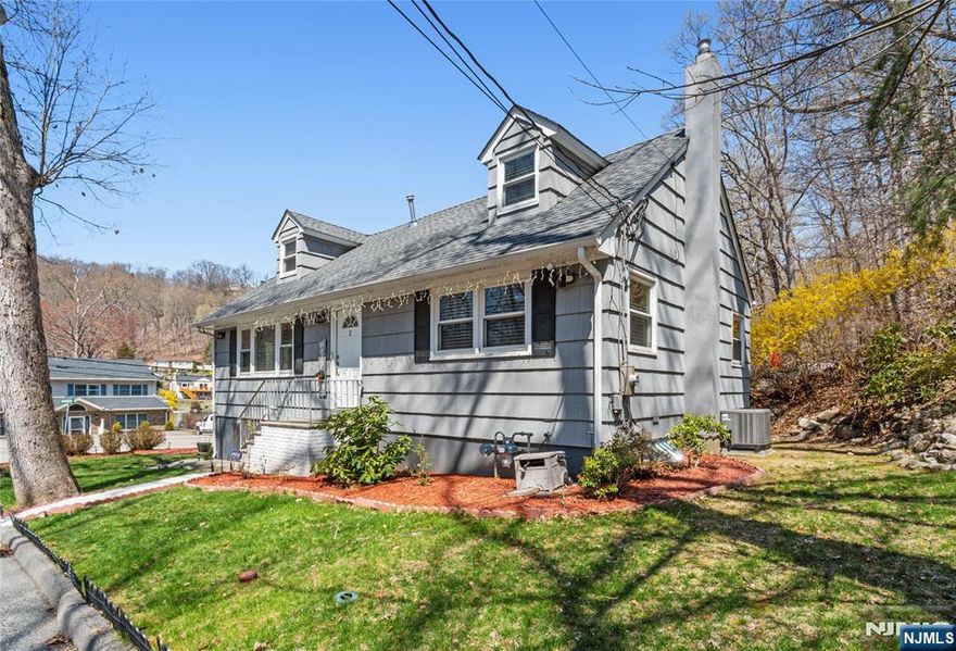 Lovely Cape with views of Skyline Lake was renovated in 2019. Lovely Kitchen with Granite Counters and Stainless Appliances, double door stainless fridge, tiled backsplash, Large living Room dining L. Hardwood floors, Central air, 3 Bedrooms plus Den and Office! 2 Full bathrooms! Great basement storage with garage entrance. Rear deck with lake views. Owner recently sodded the front lawn. This home is move in ready