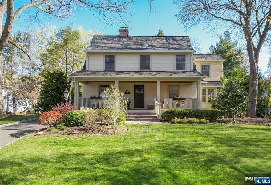 Nestled in the heart of Ridgewood, this home is a special offering for today's modern family, with incredible scale, design and sanctuary. Renovated and expanded in 2005, it artfully blends modern elements with historical charm. The heart of the home is a 10' ceiling open living space between a modern kitchen with Dacor appliances overlooking a family room highlighted by tall windows with chic black trim. Seamless flow between the office, dining room and living room with fireplace, with a mudroom and powder room complete the 1st level. The primary suite features vaulted ceilings, a luxurious bath and walk-in closet. Completing the upper level are 3 bedrooms, a full bath and walk-up attic. The finished basement (2018) boasts 9' ceilings, a gym, rec room and full bath. Additional highlights include a freshly painted interior, expansive mahogany porch and blue-stone steps to a patio with a fire pit, perfect for entertaining. All this and just blocks from RHS, downtown & NYC transit!