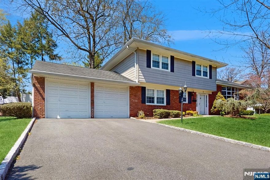 Welcome to this well maintained home of 2,350 square feet located on a beautiful tree lined street in the highly sought after community of Demarest. The entry foyer leads to a half bath along side the ground level bedroom. There's a woodburning fireplace in the family room. Enjoy the living room/dining room with vaulted ceiling and light streaming in from the floor to ceiling windows. The kitchen is updated and is eat in. Upstairs you have your primary suite with an updated bath. There are two additional bedrooms and a hall bath. Take a leisurely stroll to the town shops, NYC transportation (the city that never sleeps), top rated schools, park and houses of worship.