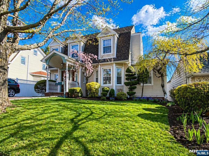 Welcome to one of Hasbrouck Heights' most sought-after neighborhoods. Your next home puts you steps from downtown, top-rated schools, parks, and the Boulevard with midtown direct bus service to New York. It's a walk-everywhere kind of location. Inside, character and comfort meet. The living room centers on a wood-burning fireplace, framed by hardwood floors and oak trim. A formal dining room connects to the updated kitchen, which has its own dining area, ideal for morning coffee or casual meals. A flexible first floor room adapts to your needs: guest bedroom, home office, library, or den, with a bathroom right nearby. The primary suite delivers hotel-level comfort. Marble countertops and flooring, a soaking tub, and a walk-in shower define the spa-like bathroom. The bedroom offers abundant closet space and an upstairs washer dryer hookup. Outdoors is where this home really shines. Mature landscaping surrounds a beautiful yard, a custom stone brick driveway adds character, and the deck with hot tub invites you to entertain or unwind. A finished basement expands your living space with a family room, laundry, and storage. The detached building in back offers extra space with loft storage. . Electric Vehicle charging station setup in driveway, sellers are willing to leave or remove.