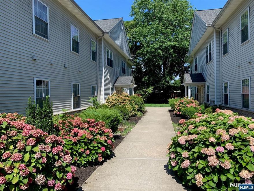 Two Bedroom First Floor Apartment, built in 2005, in attractive complex in tree lined quiet setting. All hardwood floors throughout. Gas heat and Central Air. Modern Kitchen with updated stainless steel appliances and granite counters. Full sized washer and dryer in the unit. Bedrooms are average size, will not take large furniture.