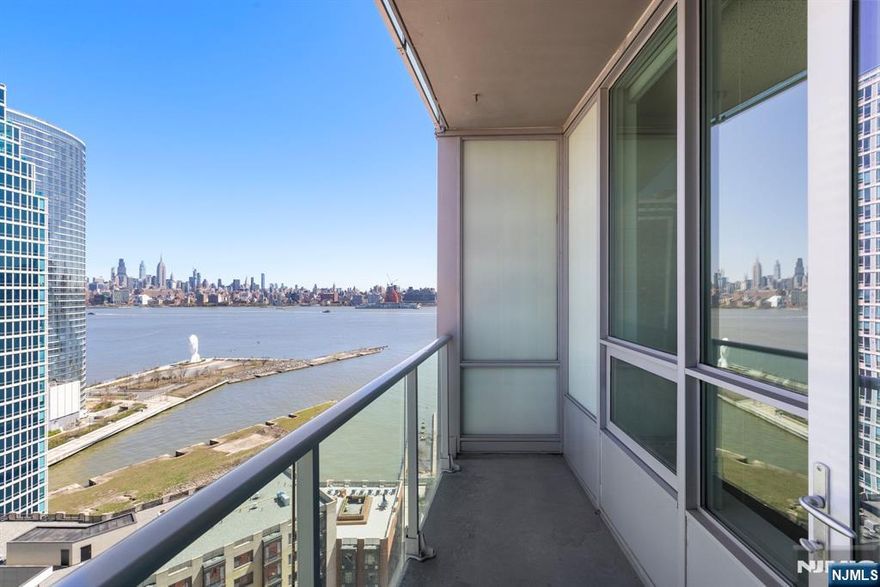 **OH - Sunday (1/25) 1pm - 3pm** Enjoy stunning NYC and Hudson River Views from this 1 bed/1 bath with a private balcony in the luxury community of 20 Newport Parkway. This home has been meticulously maintained and is in pristine condition. Chefâ€™s kitchen features stainless steel appliances and breakfast bar. The open floor plan and floor to ceiling windows provides plenty of natural light. Primary bedroom has a walk-in closet and spa-like ensuite bathroom. The home also includes hardwood floors, an in-unit washer/dryer, and central A/C. The building offers 24/7 Concierge, resident lounge, screening room, jacuzzi, sauna/steam room, conference room, fitness center, and a rooftop deck. Conveniently located near the Hoboken and Newport PATH, Newport Green Park, Morton Williams Super Market, and much more!