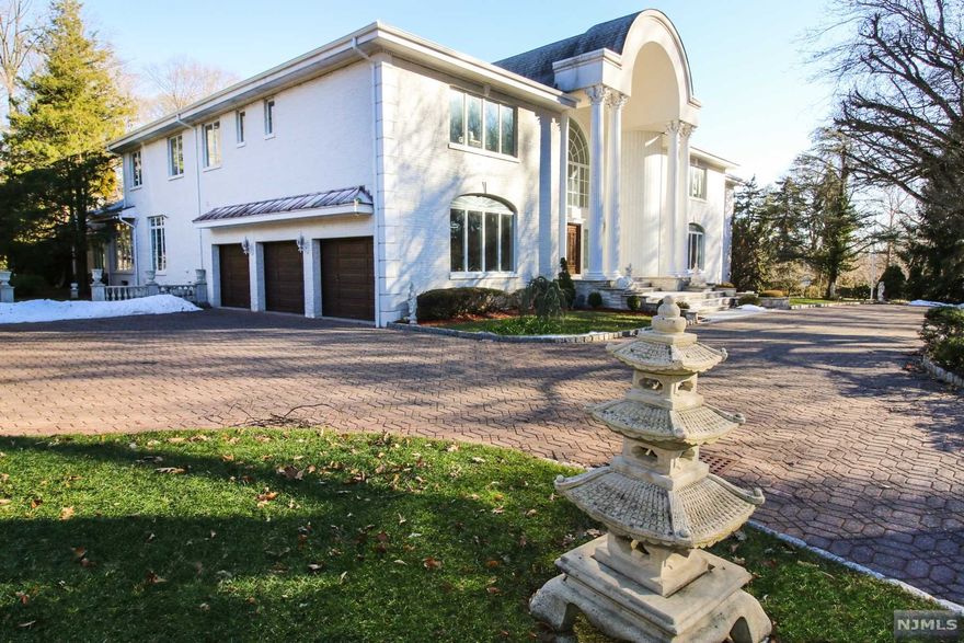 MOVE TO THE SUBURBS... Beautiful palatial home on 1.5 acres of stunning property in a private setting. Detailed wrought iron gated fencing, circular paver driveway & elegant columns invite you into 11,000 sqft opulent home. Interior includes 20 rooms with distinctive custom details. Connecting the two floors is a magnificent staircase leading to two master suites, The new chef's kitchen is as beautiful as it is functional & features elegant cabinetry, center island & high end stainless steel appliances. The breakfast room overlooks conservatory & tranquil swimming pool. Other first floor rooms include: double height formal living room, formal dining room, family room/tea room, library with balcony, Moroccan sitting room, conservatory, bed room sitting area, indoor pool room 2 full bathroom & mud/laundry room. The lower level has a bedroom, full bath, summer kitchen, powder room, den & laundry. Priced to sell, Don't miss the opportunity, it won't last...