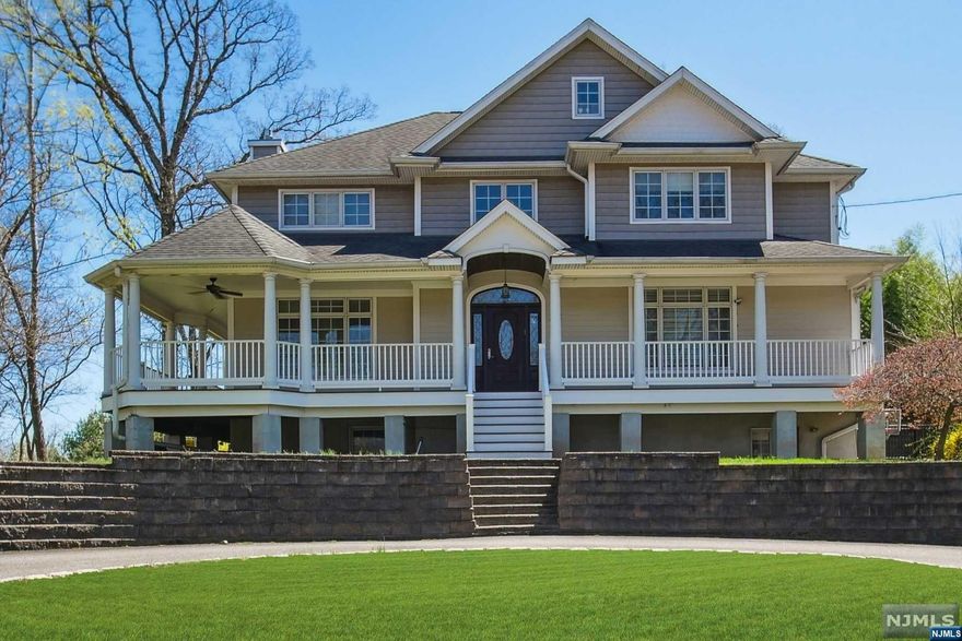 Experience luxury living in this meticulously crafted, custom Hamptons -style colonial boasting 4 bedrooms and 3.1 baths. nestled on a serene cul-de-sac overlooking parkland.Step inside to discover an inviting open-concept floor plan where the center island kitchen flows seamlessly into the family room, complete with a cozy gas fireplace. Built in 2013 this home features a blend of elegance and modern convenience. Embrace an active lifestyle with amenities such as an exercise room, and a first floor library with custom built-ins, ideal for working from home. Enjoy the tranquility of the outdoors on the full wraparound front porch or the private patio, perfects for alfresco dining or simply soaking in the scenic views.other features include 1st floor laundry , butlers pantry , wood floors, finished basement and central vacuum. Close to NYC transportation, shopping, houses of worship, recreation and fine dining.