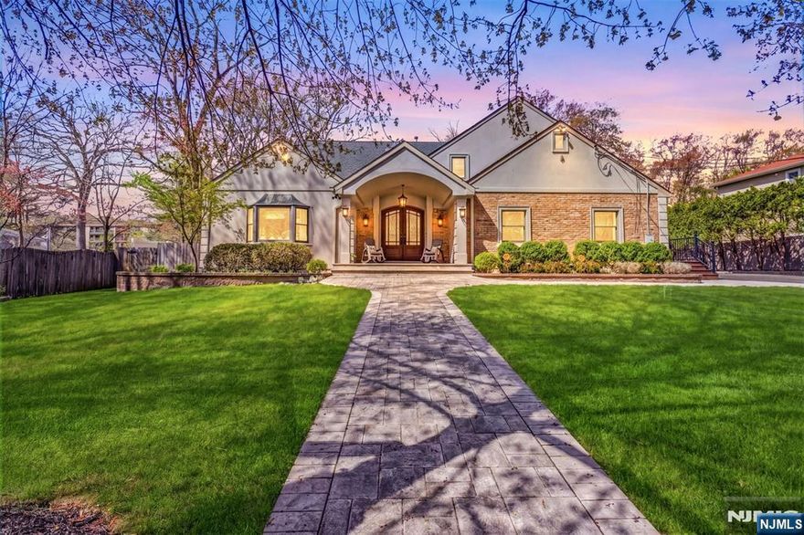 Exceptional Colonial offering a total of 6,200 sq ft on nearly 3/4 acre in the heart of River Vale. Sun-filled interiors create a warm, inviting atmosphere throughout. The main level features formal living and dining rooms with seamless access to the backyard, and an updated eat-in kitchen with quartz countertops and high-end appliances, including a new 5-burner cooktop with retractable ventilation. The kitchen opens to a spacious family room with fireplace, custom built-in reading nook, and coffee bar. A private first-floor junior suite with full bath, walk-in closet, and separate entry offers ideal flexibility for guests or extended living. This level also includes a powder room, laundry, and oversized 3-car garage. Upstairs, the primary suite offers a spa-like bath with radiant heated floors, joined by three additional bedrooms - one with an attached bonus room - two updated full baths, and a second laundry area. A standout feature is the expansive second-floor great room, featuring a brand-new high-end wet bar and an impressive space for entertaining or relaxing. The finished lower level includes a large recreation area, gym, yoga studio, sixth bedroom, and full bath. Designed for seamless indoor-outdoor living, the expansive backyard features a newer Trex deck, covered lounge with gas fireplace, and a built-in 17-foot hot tub- creating a true lifestyle experience. Donâ€™t miss this rare opportunity to own one of River Valeâ€™s most impressive homes!