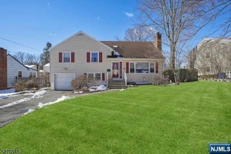 Just Move In & Enjoy This Spacious Updated Home w/Great Open Floor Plan In The Heart Of Livingston! 1 Block To NYC Bus, Eateries, Shopping & Houses Of Worship. This Fine Home Boasts 4 Bedrooms, 4 Full Bathrooms, Multiple Levels of Living with Large Open Flow Rooms And Space For Outdoor Entertaining, Allow For Comfortable Areas For All Your Gatherings. The First Floor Features A Welcoming Entry To The Formal Living Room w/Wood Burning Fireplace and Large Bay Window, Formal Dining Room, Sleek Modern Eat-in Kitchen w/An Abundance Of Cabinet Storage, Beautiful Granite Counter Tops, Stainless Steel Appliances, Breakfast Bar, Open Concept Family Room Featuring A Vaulted Ceiling and Sliding Door To Deck. Second & Third Level Features 4 Bedrooms, Including Primary Suite w/Full Bath, Hall Closet, and Additional Full Bath. Ground Level Offers Perfect Flex Space: Den and Exercise Room or Office, Full Bath and Entry Into Garage. Few Steps Down To Finished Basement w/Sitting Room, Full Bath