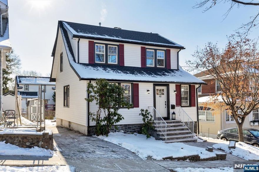 Tastefully restored 3 BR 2.5 Bath Colonial with a brand-new kitchen, bathrooms and finished basement. This renovated home offers: brand-new central a/c, furnace, siding, roof, all new wiring, new plumbing with central vacuum, new 220-amp electrical system with a new back deck, a nice yard & updated windows. This is a beautiful home with restored hardwood floors and welcomes a cozy LR with a wood burning fireplace with an open Dining Room/Kitchen, a front office with a new half bath on the first floor. The entire home showcases cleanliness, charm, beauty and plenty of natural light. Basement welcomes a nice size kid friendly recreation room with a new full bathroom, laundry closet, new surrounding French drains, sump pump and storage. Location is great: walk to NYC Express bus, school also convenient shopping and is only a few minutes' drive to all major highways, hospitals, shopping centers, Met Life Stadium and NYC.