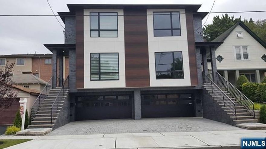 BRAND NEW ALL BRICKDUPLEX IN PRIME LOCATION(ONE BLOCK AWAY FROM BROAD AVE). MORDEN DESIGNED HOUSE FEATURES HARDWOOD FLOORS THROUGH,10FT CEILING WINDOW LIVING ROOM,WITH FIRE PLACE ,LARGE QUARTS CENTER ISLAND KITCHEN WITH HIGH END CUSTOM MADE CABINETS,TOP APPLIANCES,FLOOR TO CEILING SLIDE DOOR TO PATIO,HALF BATH,2ND FLOOR OFFERS FLOOR TO CEILING WINDOWMASTER BR,TOP QUILITY MASTER BATH,2BRS,FULL BATH,WASHER/DRYER,SKY LIGHT. GROUND FLOOR OFFERS OFFICE,FULL BATH, VISIBLE GARAGE DOOR 2 CAR GARAGE ,FLAT DRIVE WAY. CLOSE TO TRANS, CLOSE TO SHOP..