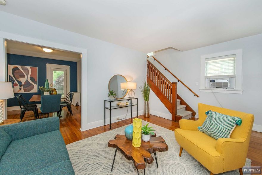 Minutes from Bloomfield midtown direct NJ Transit train station to NYC & beautiful Watsessing Park, this adorable freshly painted 2/3 bedroom side hall colonial is the perfect first time or downsizing home. 1st floor features an enclosed porch, sun-drenched living room, recently renovated crisp white kitchen w/ ample cabinetry/countertop & sizable formal dining room w/ walk-out to lushly landscaped yard. 2nd floor boasts a spiffy newer bath, 2 peaceful bedrooms, plus a cozy 3rd room for office/nursery or walk-in closet/dressing room. Basement w/ laundry & storage is as clean & ripe w/ potential. Back features a refinished wooden deck, ideal for entertaining w/ full privacy fence encircling just the right amount of yard! New water heater/furnace/dryer, plenty of storage, shiny hardwood & laminate floors, replacement windows, newer siding & roof w/ solar panels. Near shops/eateries/parks/schools, this sweet heart of a home is a commuter's dream!