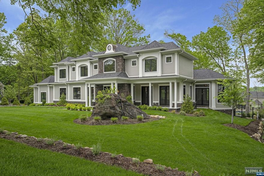 An architectural masterpiece that connects friends & family while redefining luxury living. Quality exceeds expectations in this one-of-a-kind 10,000sf living space estate. The coveted cul-de-sac is home to an Ariella Horwtiz design complete with six bedrooms & six and half baths. Soaring cathedral ceilings in the entry foyer immediately take you breath away. The first floor a modern open floor plan. Living room boasts a designer feel with a dual gas fireplace adjacent to the conservatory. Kitchen has white Oak cabinets, WOLF range, built-in espresso bar, wine refrigerator. Italian marble countertops formal dining room has special built-ins An office or first floor guest room has plenty of sun. The pantry has endless storage to bring the inner chef out in you. The second floor is home to four bedrooms and four baths. The ground floor has a home theater, gym, wine tasting room and cellar. A guest room and full bath is ideal for company and refreshing from a dip in the Hampton.