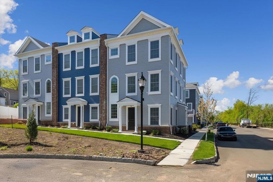 Welcome to this stunning, sun-drenched home spread across three spacious levels! Be the first to live in this 2,196 sq ft New York Model featuring high ceilings, multi-zone high efficiency heating/cooling, and hardwood floors. The main level boasts a modern kitchen with stainless steel appliances, granite countertops (quartz in all bathrooms), stylish dual sided fireplace, and a convenient powder room. Upstairs, youâ€™ll find a luxurious master suite with large closets and a full bath, plus laundry on the same floor. The ground level offers dual sided access from the exterior, 2 car garage, and a bright office space and an additional full bathâ€”perfect for guests or working from home. Located near NYC transportation and everything Teaneck has to offer. With snow removal, landscaping and trash pickup included, this Townhome offers luxury living, hassle-free.