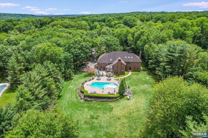 Beautiful High Ridge location & a quality custom build, including steel beam construction, by these original owners. 2 story entry foyer that opens to balcony above, overlooking the 2 story Great Rm w floor to ceiling stone fireplace, 25' ceilings, herringbone flooring & beautiful bar area. French doors, pocket doors, custom paneling, skylights & more. An incredible opportunity for a discerning buyer to make this home their own. Gorgeous setting w mature trees surrounding the fully fenced, private & flat property. Generously sized rms throughout w terrific closet space. First flr features LR, beautiful library/office w/ fpl, 1st flr bedroom suite, formal DR, tremendously sized kitchen w/ new appliances & bfast rm. Adjacent laundry,PR & playrm (possible 6th BR). Upstairs 4 large BRs incl primary suite w/ fpl & adjacent office/nursery/flex space. Front & Rear staircases. An incredible setting w a gorgeous inground pool & patio surround. An entertainers dream!