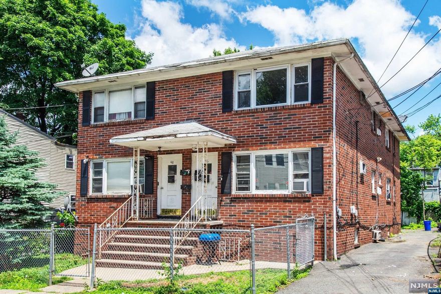 Welcome to this beautifully maintained four-family brick home, perfectly situated in the heart of Irvington, NJ. This property offers a fantastic investment opportunity and potential to collect about $8000 in monthly rental income. Featuring four spacious and well-appointed units, each with its own unique charm and character. Each unit offers a generous layout with ample natural light, hardwood flooring, and high ceilings. The units are designed to maximize space and comfort, featuring large living rooms, eat-in kitchens, and nice sized bedrooms, the bathrooms are clean and well-maintained. A full, partially finished basement provides an additional bathroom and possible 5th unit on one side and the other side is equipped for laundry facilities. The property includes off-street parking ensuring convenience for tenants. Close to major highways, transportation, schools and shopping.