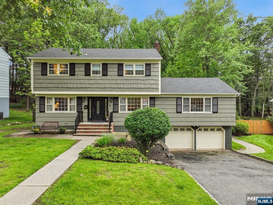 Welcome to your perfect retreat - beautifully expanded home features a private, park-like yard that's a haven for staycations and entertaining and offers endless possibilities for outdoor enjoyment with a spacious multi-tiered deck, sprawling paver patio, above-ground pool, and a lush, expansive lawn. The backyard seamlessly blends with wooded municipal greenbelt, ensuring tranquil privacy. Step inside to an inviting open-concept living space, seamlessly connecting the living room, dining area, updated kitchen, and appealing family room addition thoughtfully renovated since 2004. Culinary enthusiasts will appreciate the double ovens and gas range that make meal prep a joy. An optional bedroom/office/recreation room on the first floor, adjacent to a full bath, adds flexible living options. Four bedrooms and two full bathrooms on the 2nd floor. The fully finished basement expands your living experience with additional recreational and relaxation spaces, and convenient walkout to the patio and pool from the exercise room, featuring an adjoining powder room for easy poolside access. Additional highlights include abundant storage space, a laundry room, and direct entry from the two-car garage. Perfectly situated close to shopping, dining, schools, town pool, Wrensch Park, and places of worship, you'll enjoy the convenience of being just 0.3 miles from High School events and July 4th fireworks celebrations.