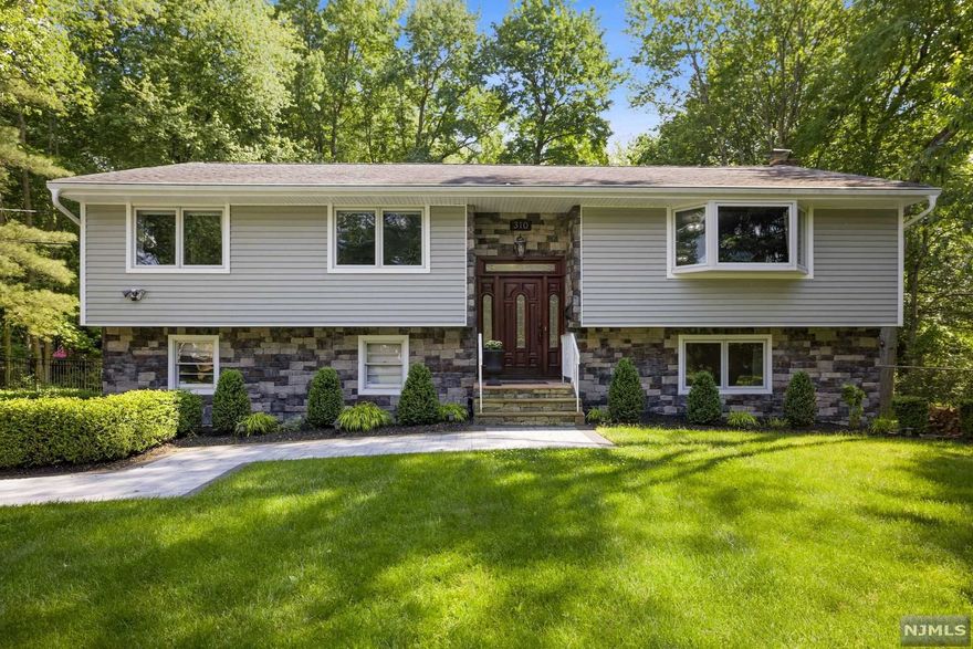 This unique home promises the ultimate in open concept living & entertaining becomes effortless inside & out. Spacious 4 bedroom, 3 bath home is situated on beautiful (125 x200) park-like grounds in the sought-after town of Haworth. Main level features open floor plan with living rm, dining area, custom modern eat-in-kitchen, leading to a beautiful great room/sitting room overlooking the private backyard. Main Level also includes Ensuite Primary Bedroom, Primary Bath, 2 add. Bedrooms & lg main bath. Lower Level, spacious & bright boasts a grand two-tier recreation rm with wood burning FPL, lg office/sunroom, bedroom, full bath, laundry, & access to the beautiful park-like property and lg 2 car garage. The luscious backyard with heated Anthony & Sylvan Gunite inground pool with jacuzzi, wood burning stove, and large paver patio with seating and dining area. Perfect for entertainment. Additional Updates and Special features throughout! Truly a magnificent home!