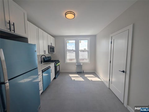 Photo of 173179 Madison ST #C2, Passaic, NJ 07055 (MLS # 26030188)