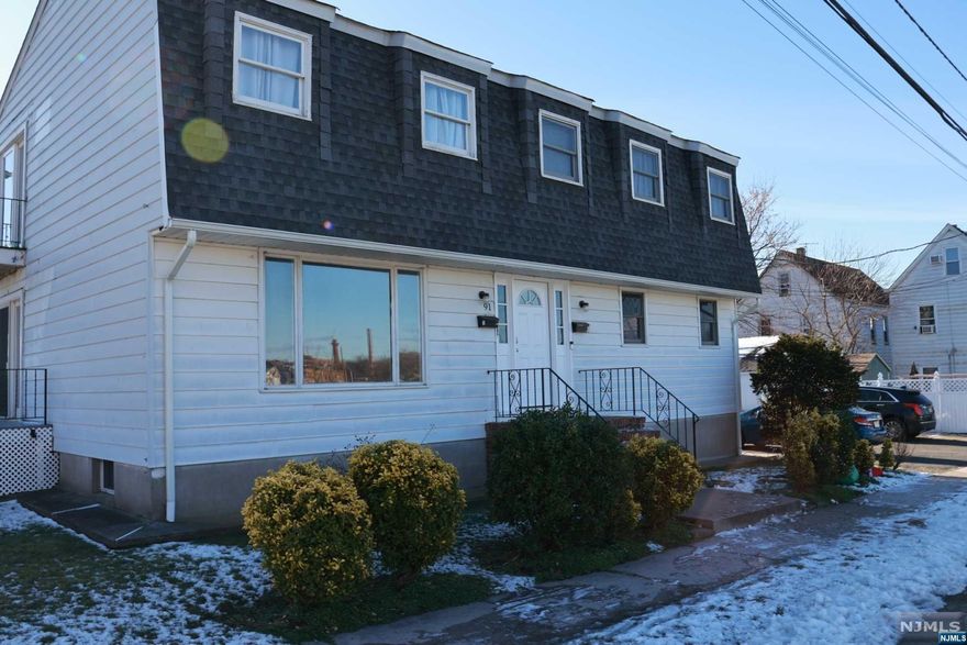 designed to maximize comfort and functionality, making them ideal for living or as an investment opportunity.The property includes a driveway with enough space to accommodate four cars, ensuring ample parking for both units. - The exterior has been well-maintained, reflecting the overall care given to the property.Situated in the friendly neighborhood of Garfield, residents enjoy close proximity to local schools, parks, shopping, and dining options. - Easy access to public transportation and major highways makes commuting a breeze