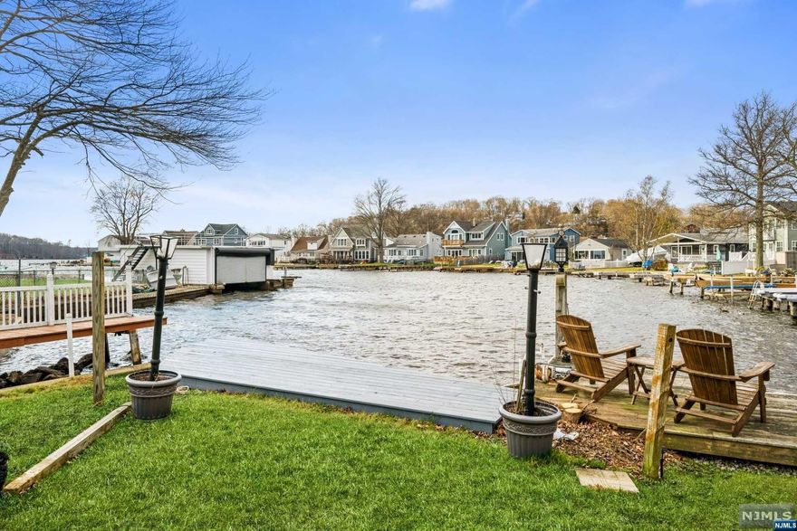 Excellent opportunity to begin a new living on the water! A perfect piece of paradise! Welcome to this tastefully renovated oasis! Nestled in a calm and quiet cove right off the main lake. Enjoy this sleek stylish turnkey home for all four-seasons. There is year-round fishing, fall apple picking, winter ice-skating, skiing and snowboarding, sunrises & sunsets. Additional features of the region offer hiking/biking trails, nearby golf/tennis, prestigious dining and a spa resort. Lastly, a major ski resort at Mountain Creek. Only 1 hour to NYC! This luxury home features an Eat-in Kit, brand new S/S appls, center island & waterfall quartz countertops. Best of all, the elegant kitchen opens up to a lg liv rm overlooking the lake with your own dock. Open flr plan boasts 3 Bed rm, 1 ba. Brand new oak wood flrs & porcelain tiles in the bath rm flr/wall. Newly refinished deck, maint free dock, new advanced treatment septic system. Waterproof & insulated crawl space. New roof & driveway.